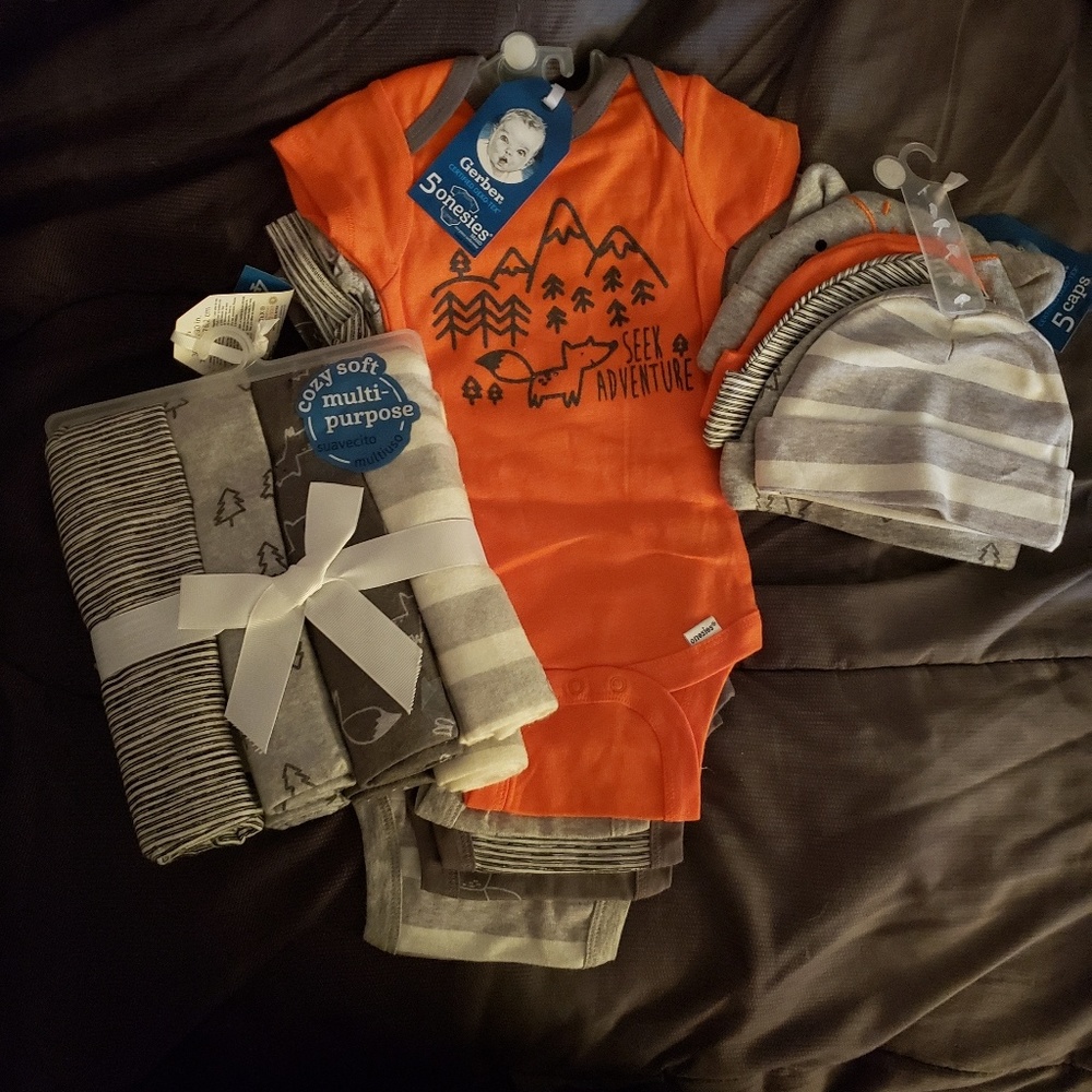 Boys onesies, receiving blankets and hats.
